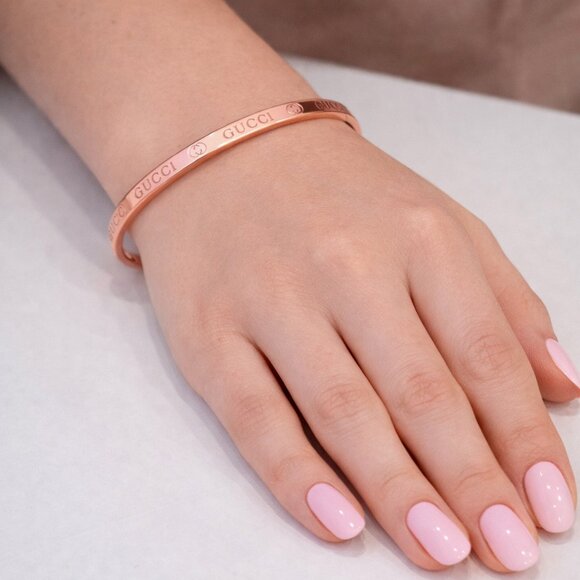 Generic Jewelry - Rose colored monogramed bracelet that opens with pull. Brand new without tags.